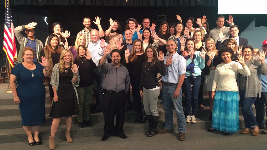 The audience at Adoption Perspectives Conference drew smiley faces on their hands to celebrate World Adoption Day.